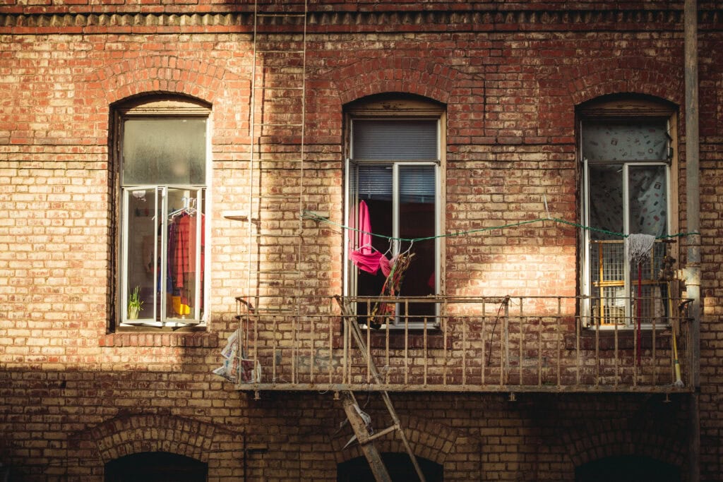 laundry in window of a Chinatown building