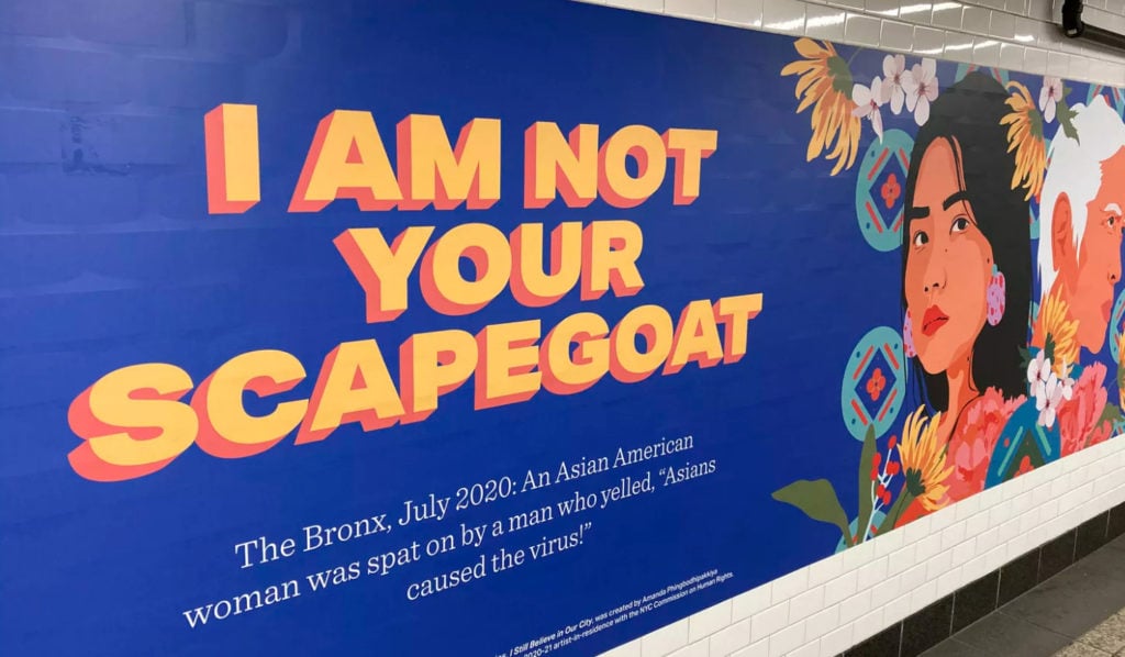 A billboard in New York City depicts an Asian American woman. The headline reads, "I am not your scapegoat." The subtitle reads: "The Bronx, 2020. An Asian American woman was spat on by a man who yelled "Chinese caused the virus!"