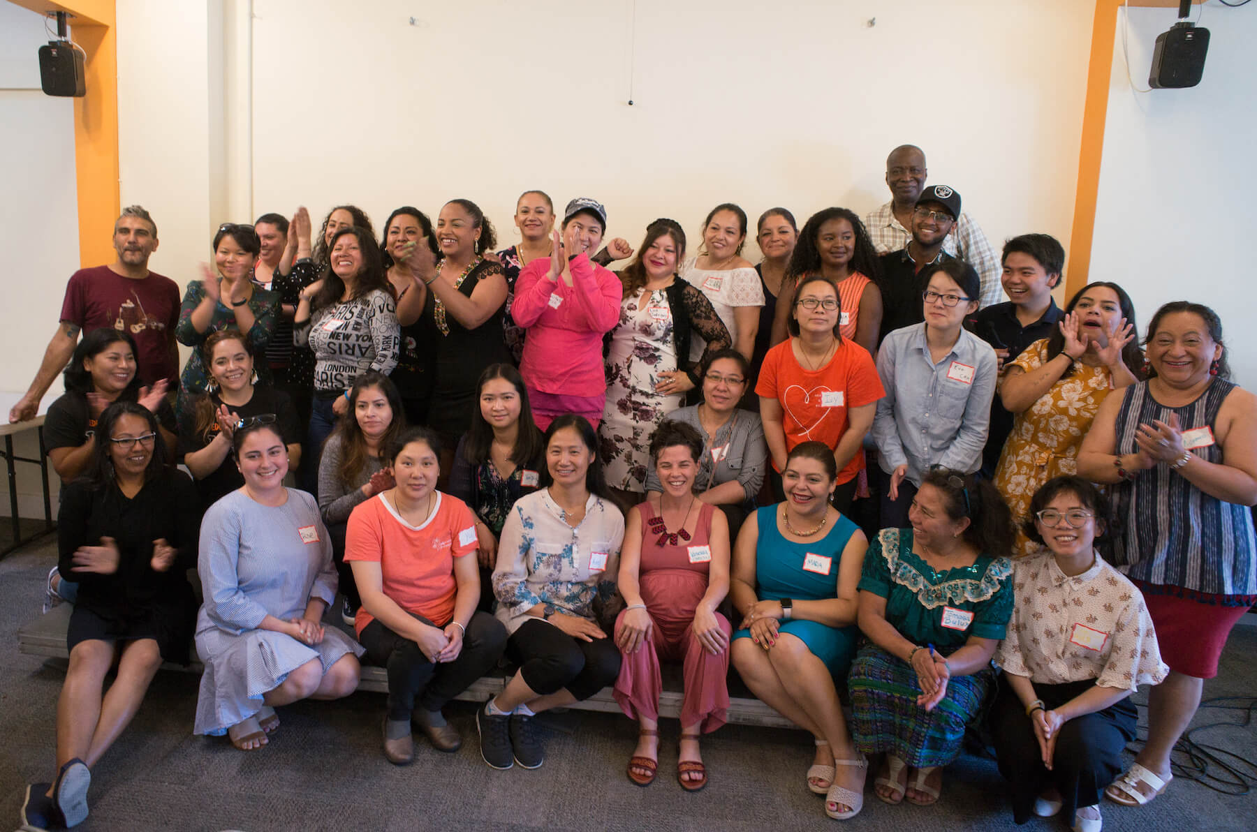 A group photo of the Immigrant Parent Voting Collaborative, which includes many Asian and Latina women.